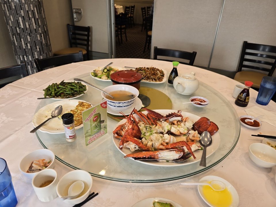 Seafood restaurant dining room with round tables.